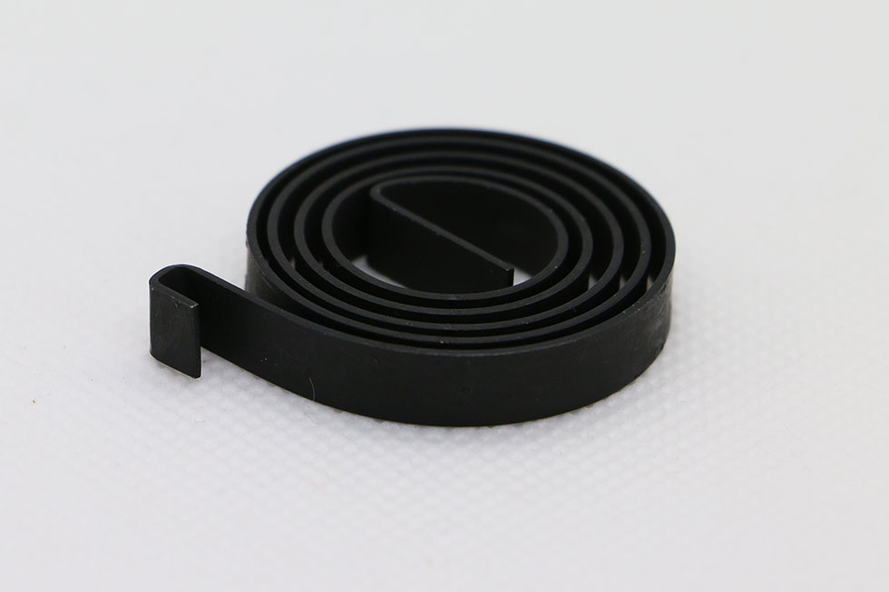 Ressort spiral en acier avec revêtement anti-bruit pour boite à gant fabrication AMS